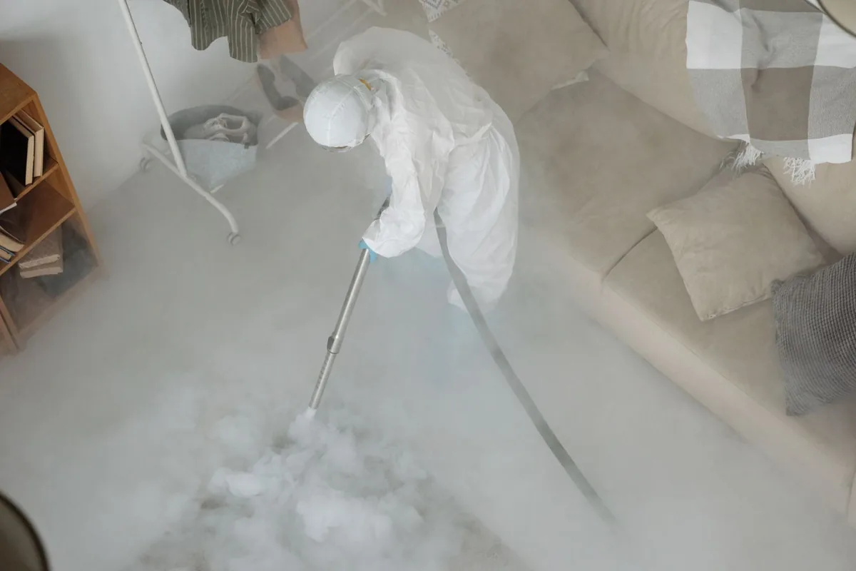 Biohazard cleanup technician in protective equipment, Hayden, AL